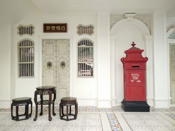 Stools at table by house