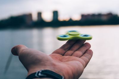 Close-up of hand holding fidget spinner