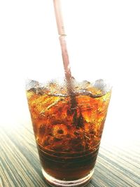 Close-up of beer in glass against clear sky