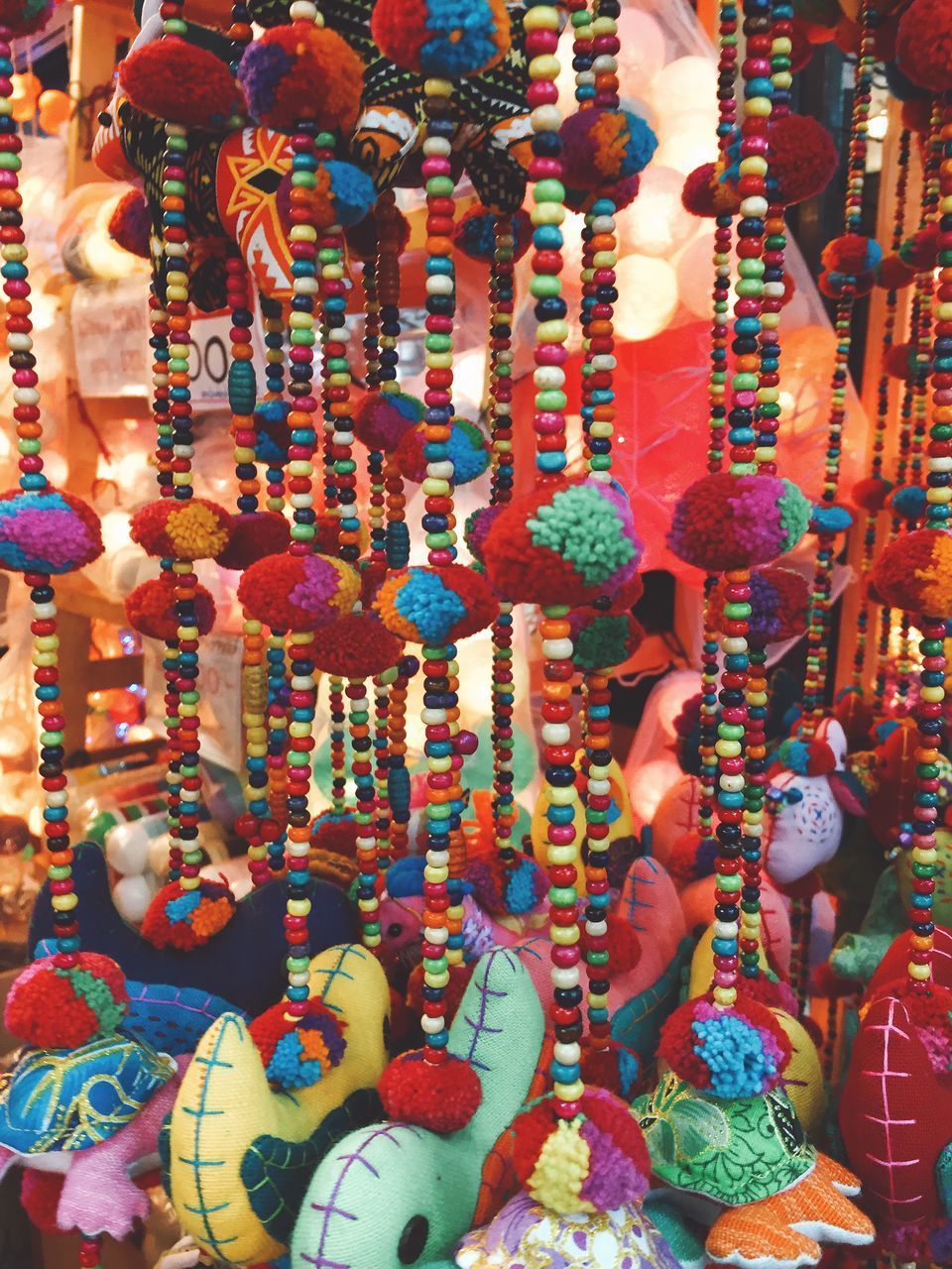 CLOSE-UP OF DECORATED HANGING IN MARKET STALL