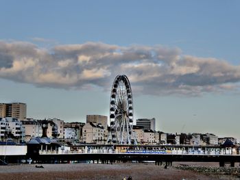 View of buildings against cloudy sky