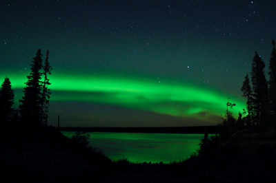 Northern lights reflected in the la grande river, quebec, canada