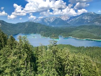 Scenic view of lake and mountains against sky