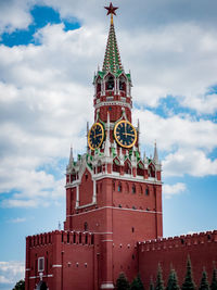 Low angle view of clock tower against sky. the main tower of moscow kremlin - spaskaya on red squer