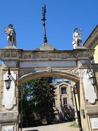 Low angle view of statue against historic building