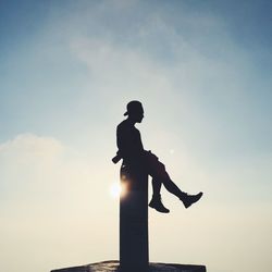 Low angle view of silhouette people against sky during sunset