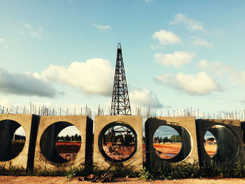 View of bridge against cloudy sky