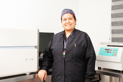 Female scientist working at the laboratory with a thermal cycler. polymerase chain reaction.