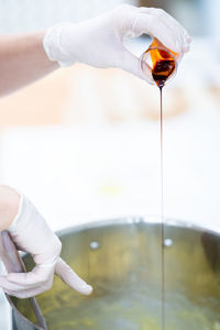 Close-up of hand pouring water