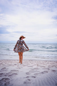 Full length of woman walking on beach