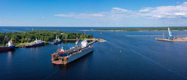 Cargo ship at floating dry dock is being renovated