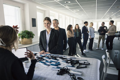 Woman picking up her pass before conference