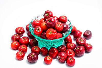 Close-up of cherries against white background