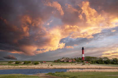 Panoramic image of pellworm lighthouse against sky, north frisia, germany