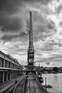 Built structures against cloudy sky