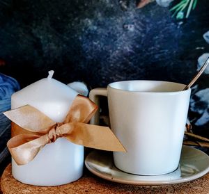 Close-up of coffee cup on table