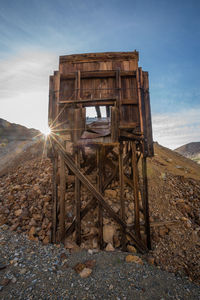 Built structure on landscape against sky