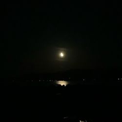 Scenic view of sea against sky at night