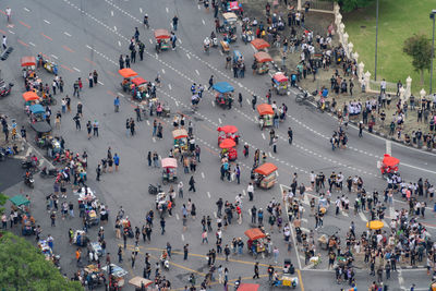 High angle view of protesters on city street during pandemic