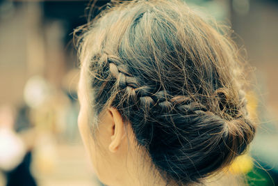 Close-up of woman with braided hairstyle