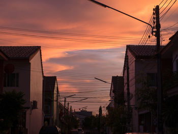 Low angle view of buildings against sky during sunset