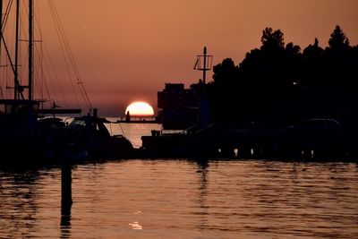 Silhouette of marina at sunset