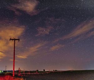 Scenic view of field against sky at night