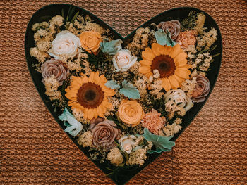 High angle view of various flowers on table