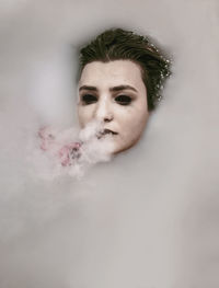 Woman exhaling smoking