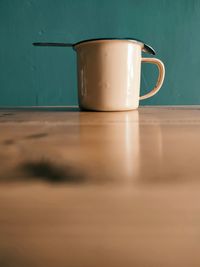 Close-up of coffee cup on table