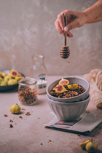 Midsection of person preparing food on table