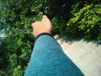 Low section of man wearing shoes