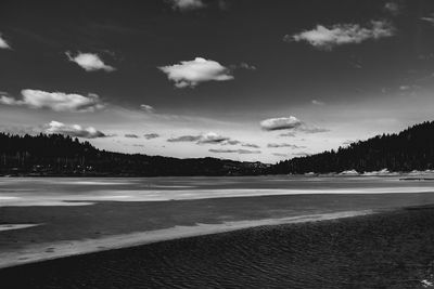 View of beach against cloudy sky