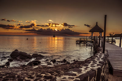 Scenic view of calm sea at sunset