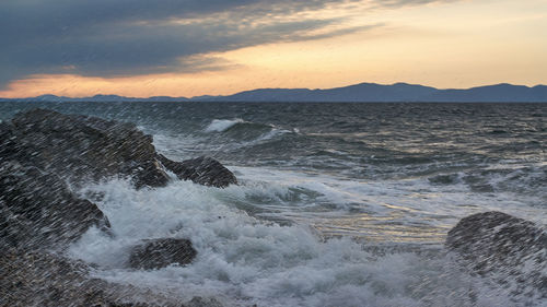 Scenic view of sea against sky during sunset