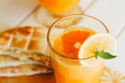 Close-up of orange juice on table