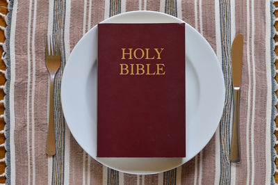 Directly above shot of information sign on table