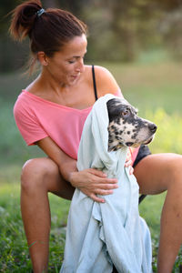 Portrait of young woman with dog