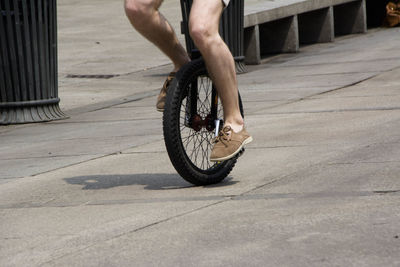 Low section of man with bicycle