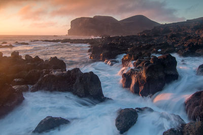 Beautiful rock structures at sunset in the coastline of island of faial in the azores