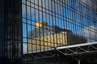 Low angle view of modern building against sky