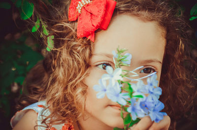 Close-up of woman with flowers