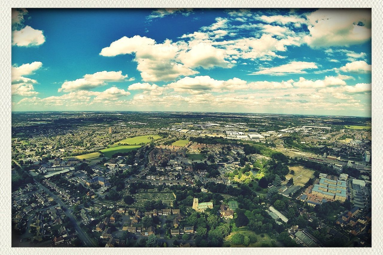 sky, transfer print, cloud - sky, scenics, cloud, sea, auto post production filter, tranquil scene, horizon over water, beauty in nature, water, landscape, high angle view, blue, tranquility, nature, cloudy, cityscape, horizon over land, aerial view