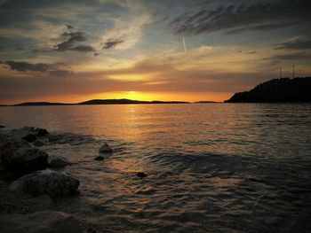 Scenic view of sea at sunset