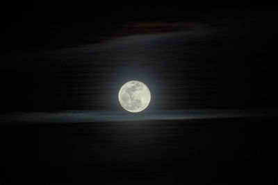 Low angle view of moon against sky at night