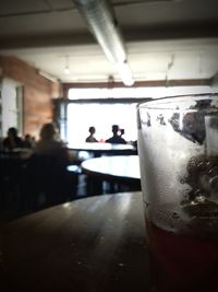 Blurred motion of woman in dark room