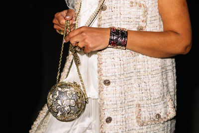 Midsection of man holding light