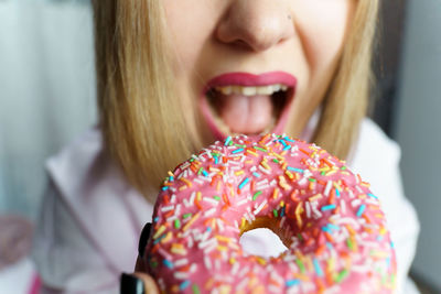 Close-up of woman holding donut