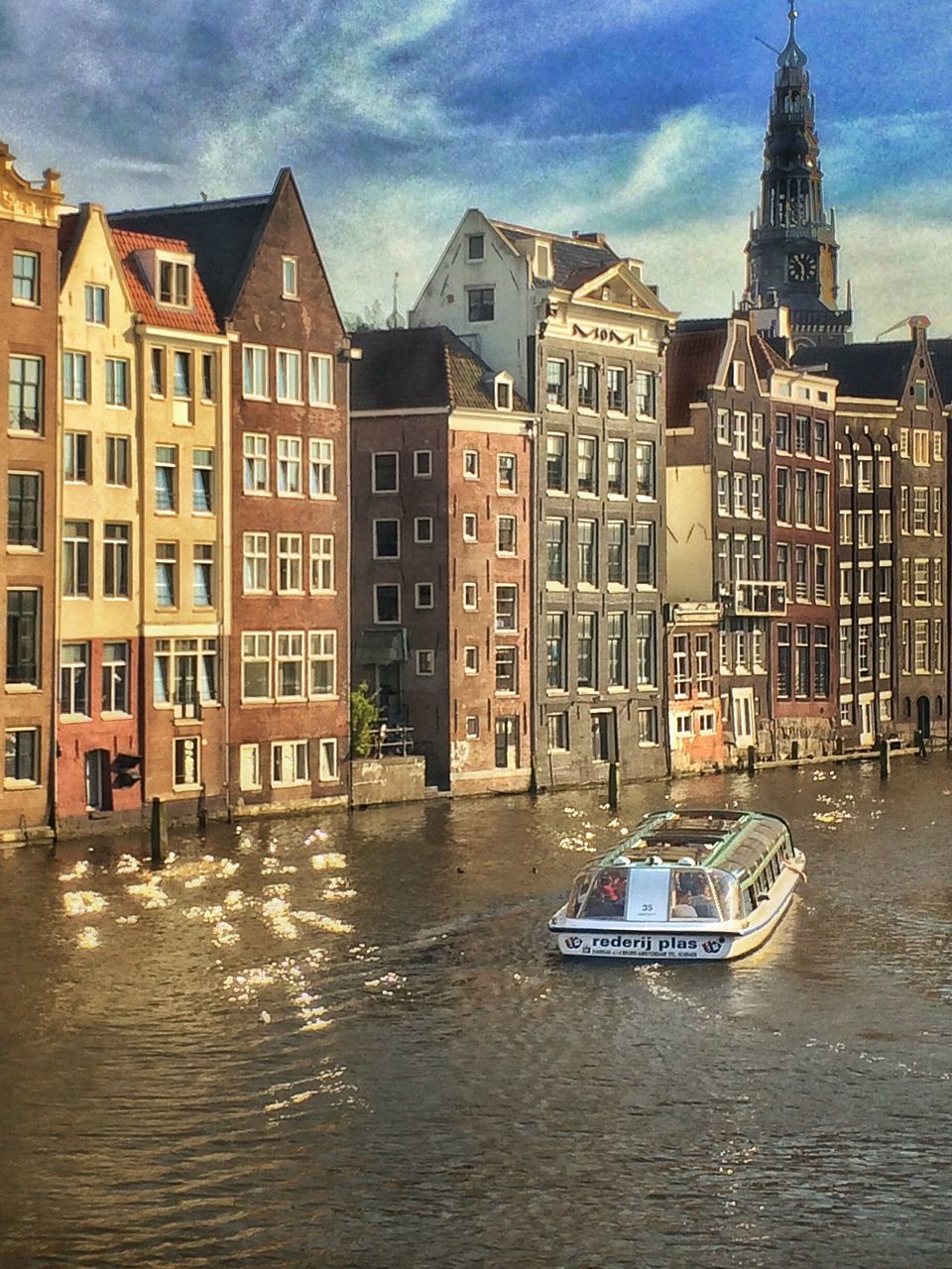 RIVER WITH BUILDINGS IN BACKGROUND