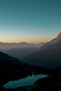 Scenic view of silhouette mountains against clear sky